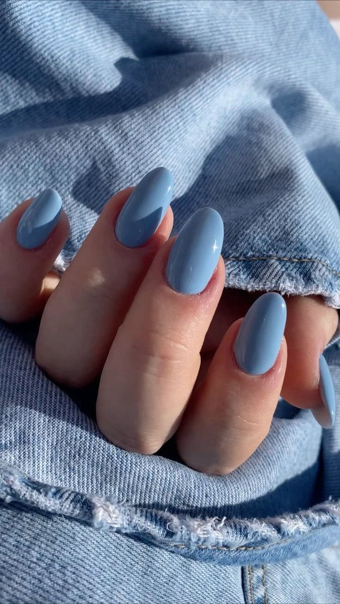Dusty blue almond nails in a clean single coat of gel