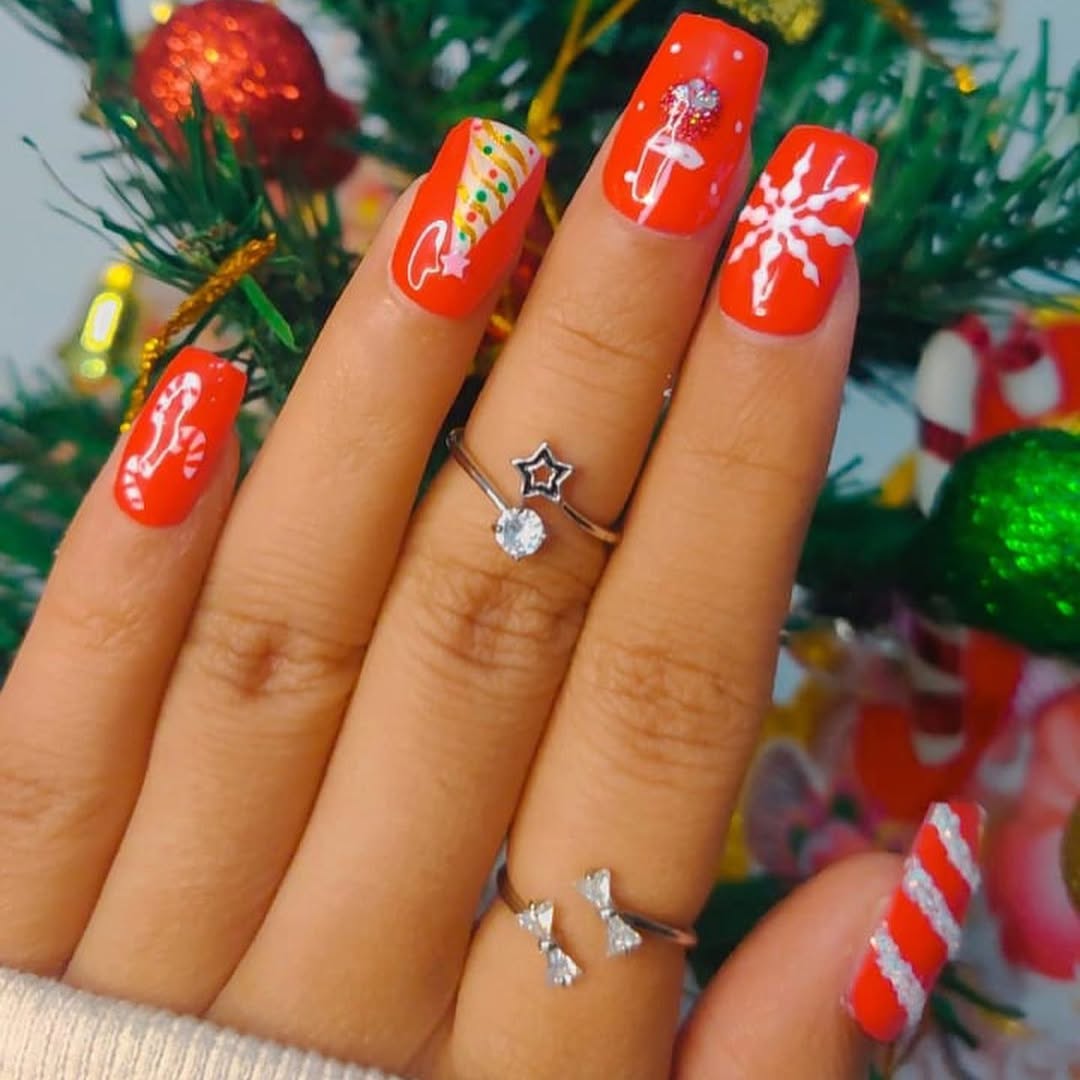 Bright red festive nails with painted candy cane and snowflake art